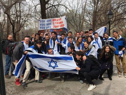 In late March, Mendy Boteach (son of media personality Rabbi Shmuley Boteach) and about 20 of his fellow New York University students positioned themselves near the “Israeli Apartheid Wall” in Washington Square Park with a 10-foot sign quoting Lady Gaga lyrics, reading, “You are brave, you are strong, you are confident, and I f*cking love you Israel.” Credit: Courtesy Rabbi Shmuley Boteach.
