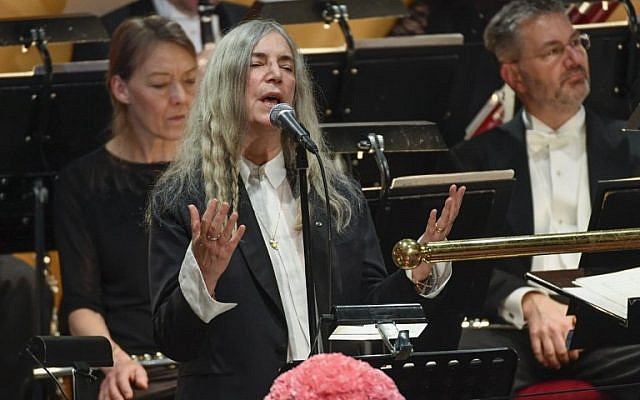 US singer Patti Smith performs 'A Hard Rain's A-Gonna Fall' by absent Literature prize winner Bob Dylan during the awardings of the Nobel Prizes in medicine, economics, physics and chemistry in Stockholm, Sweden on December 10, 2016. (AFP PHOTO/TT News Agency/JESSICA GOW)
